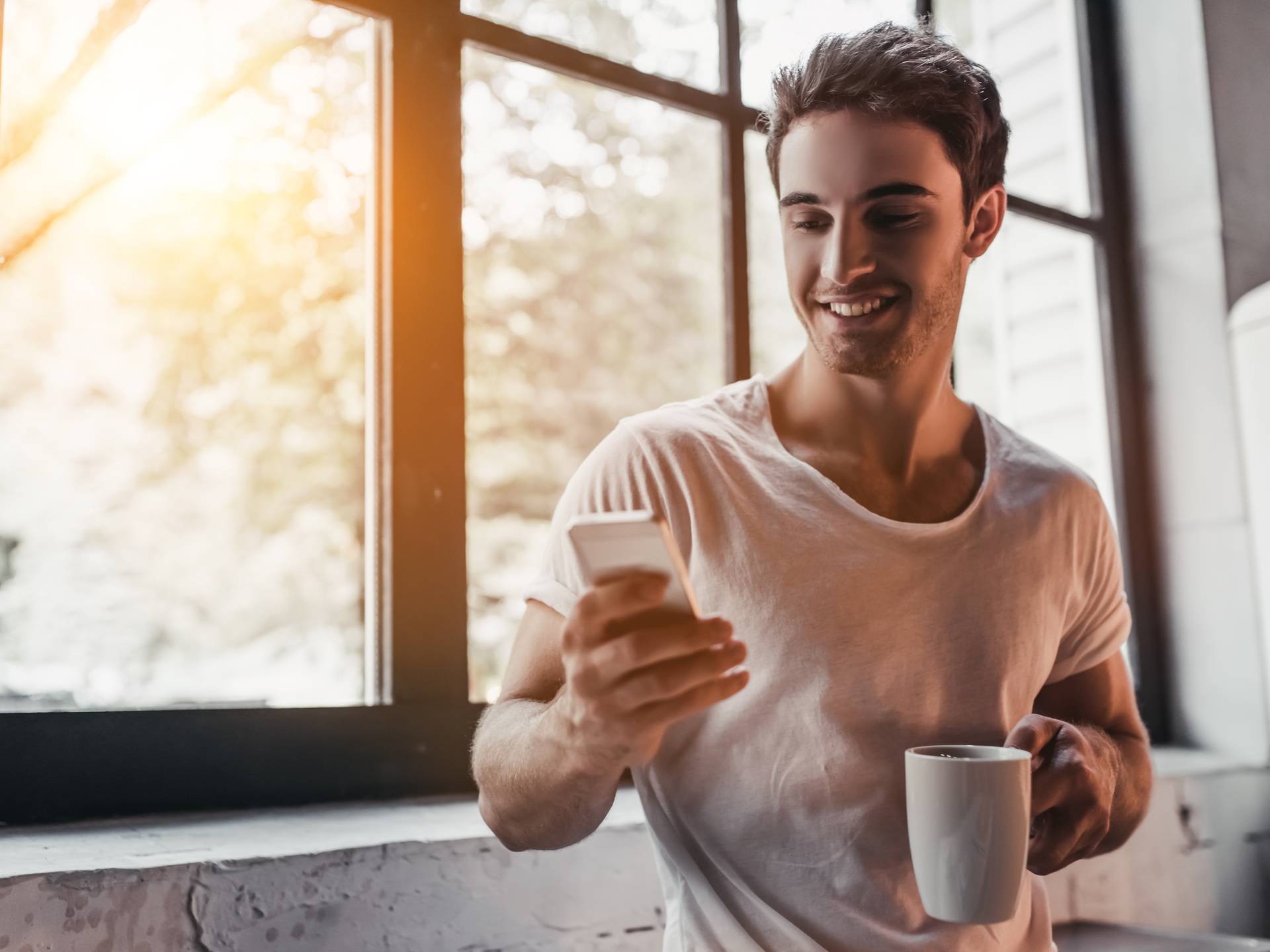 man looking at phone baseline health