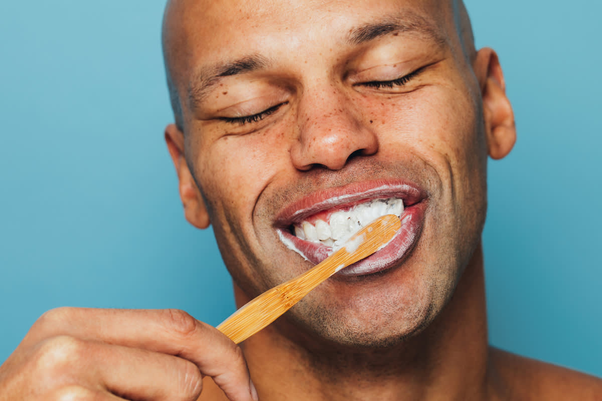 guy brushing teeth