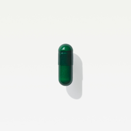 A close-up shot of a green Viome Precision Supplement capsule 